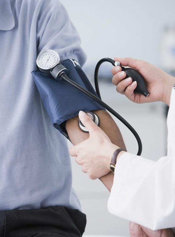 Healthcare Professional Measuring Blood Pressure with Stethoscope and Cuff