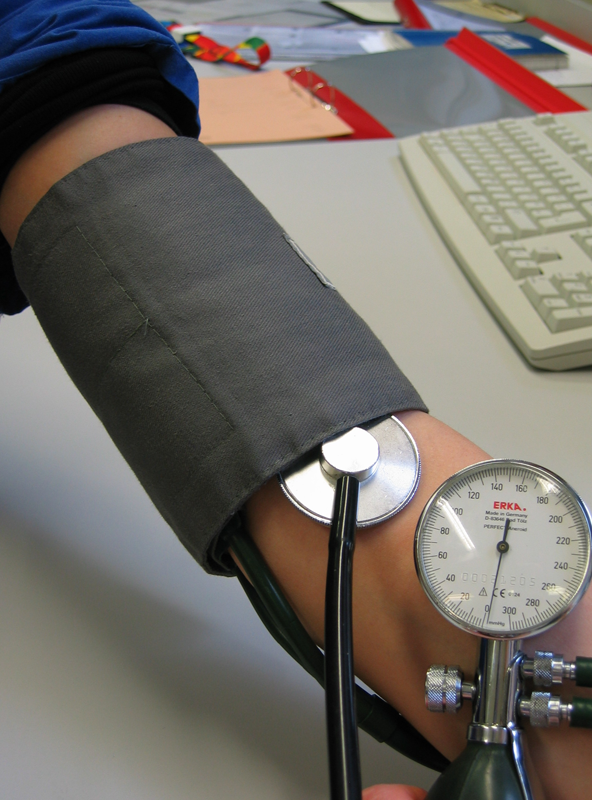Person Getting Blood Pressure Measured Using Manual Sphygmomanometer